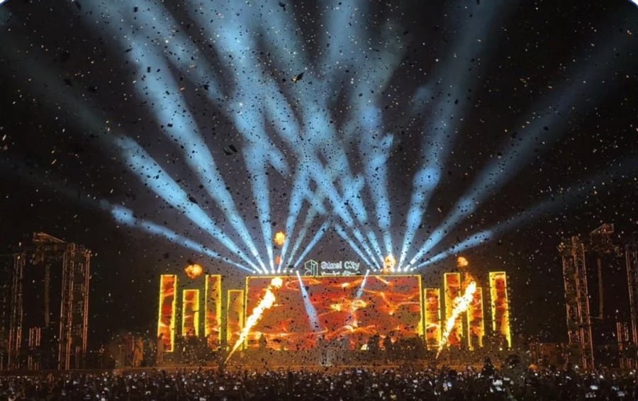 Concert stage lit with beams over a packed crowd, from the Modern Live Show gallery